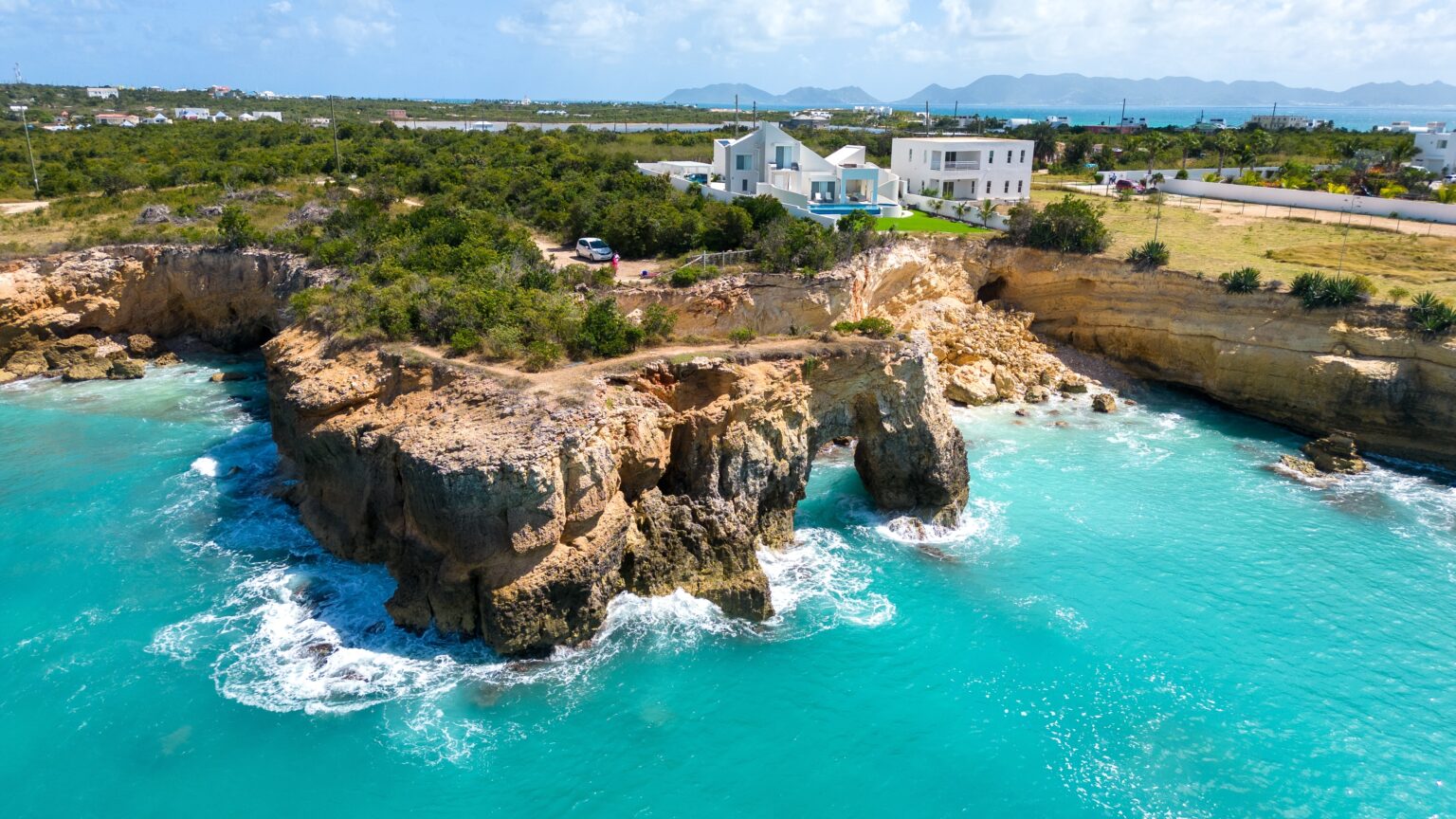Anguilla,Arch.,Natural,Hole,Carved,In,The,Rock.,Turquoise,Sea